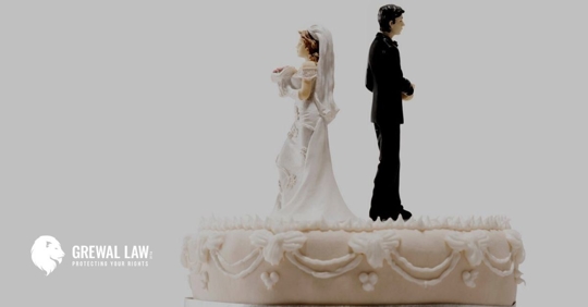 Bride and groom wedding cake toppers with their backs to each other.